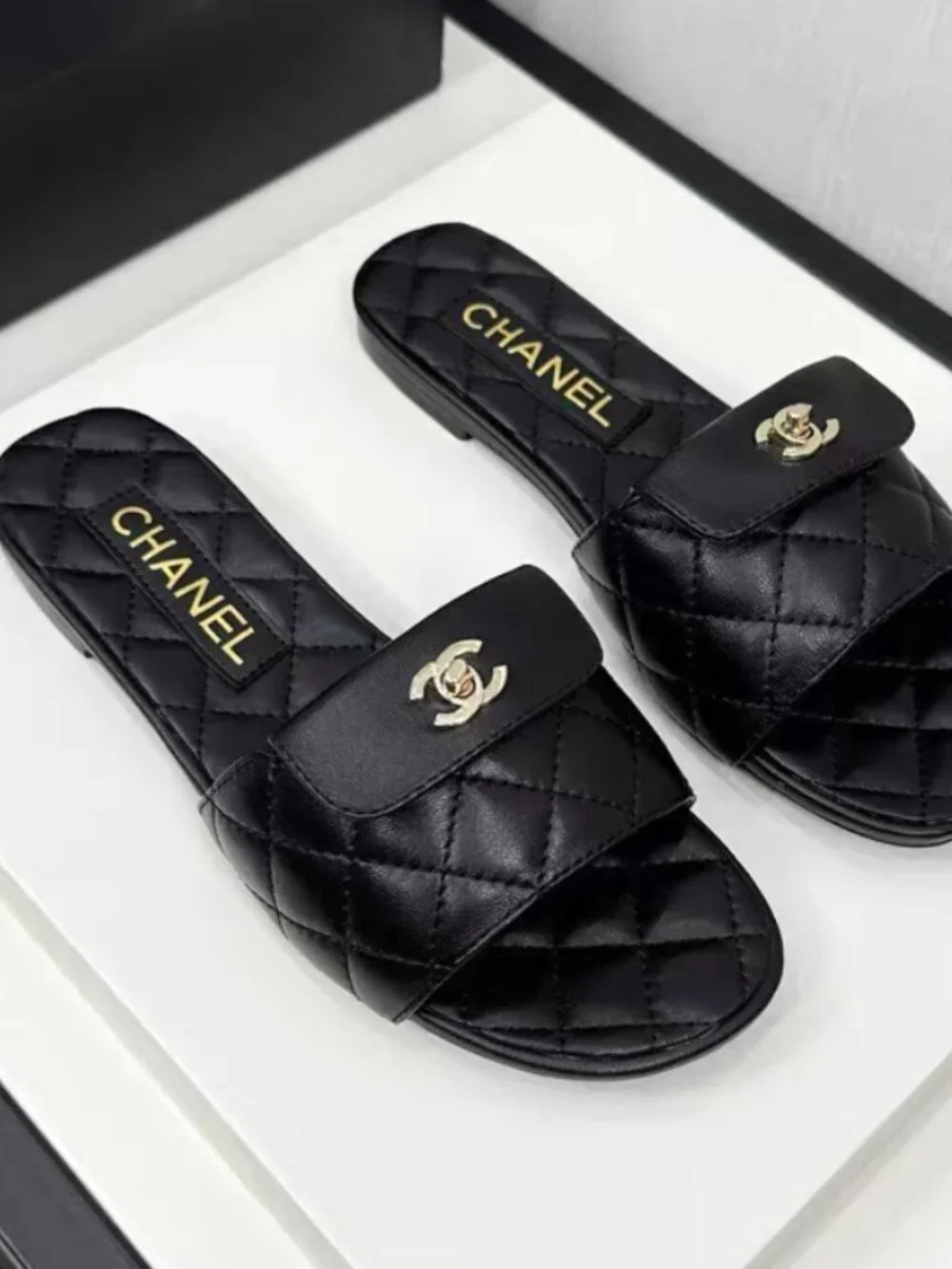 Chanel Black Quilted Lambskin CC Turn‑Lock Flat Slide Sandals
